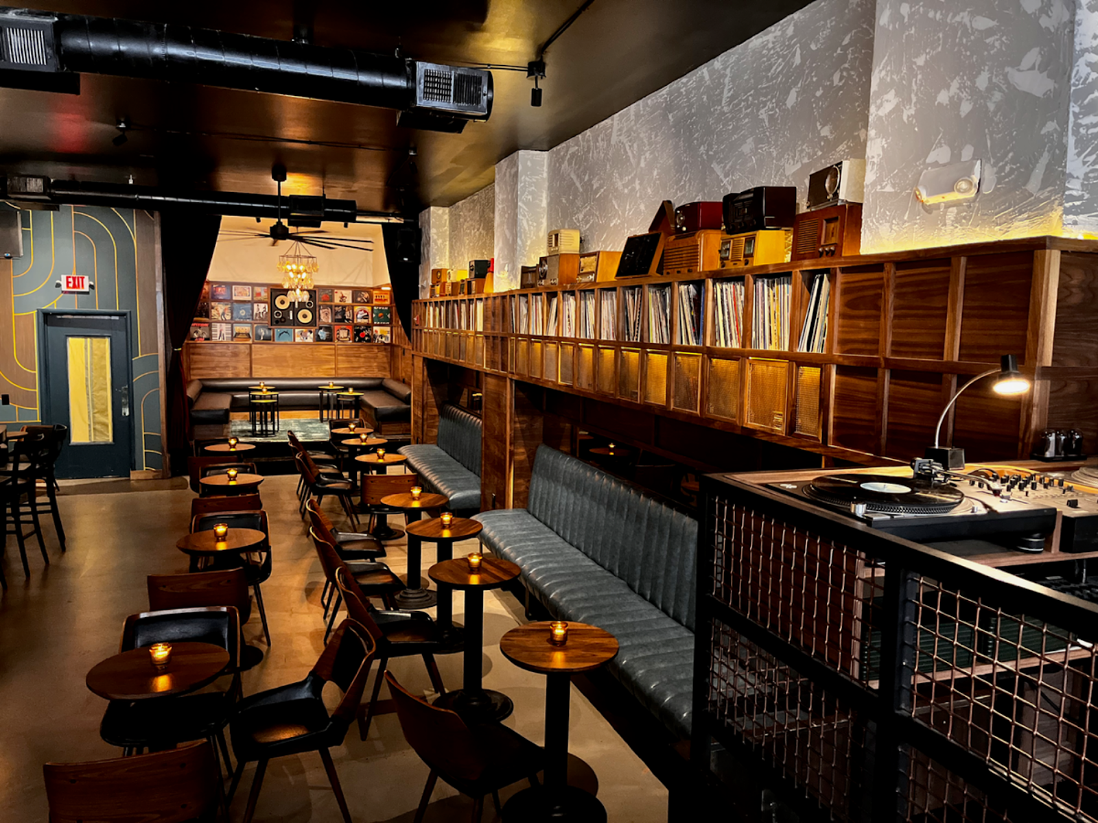 booth seating next to high shelved stocked with vinyl records at Harlan Records, Union Square SF