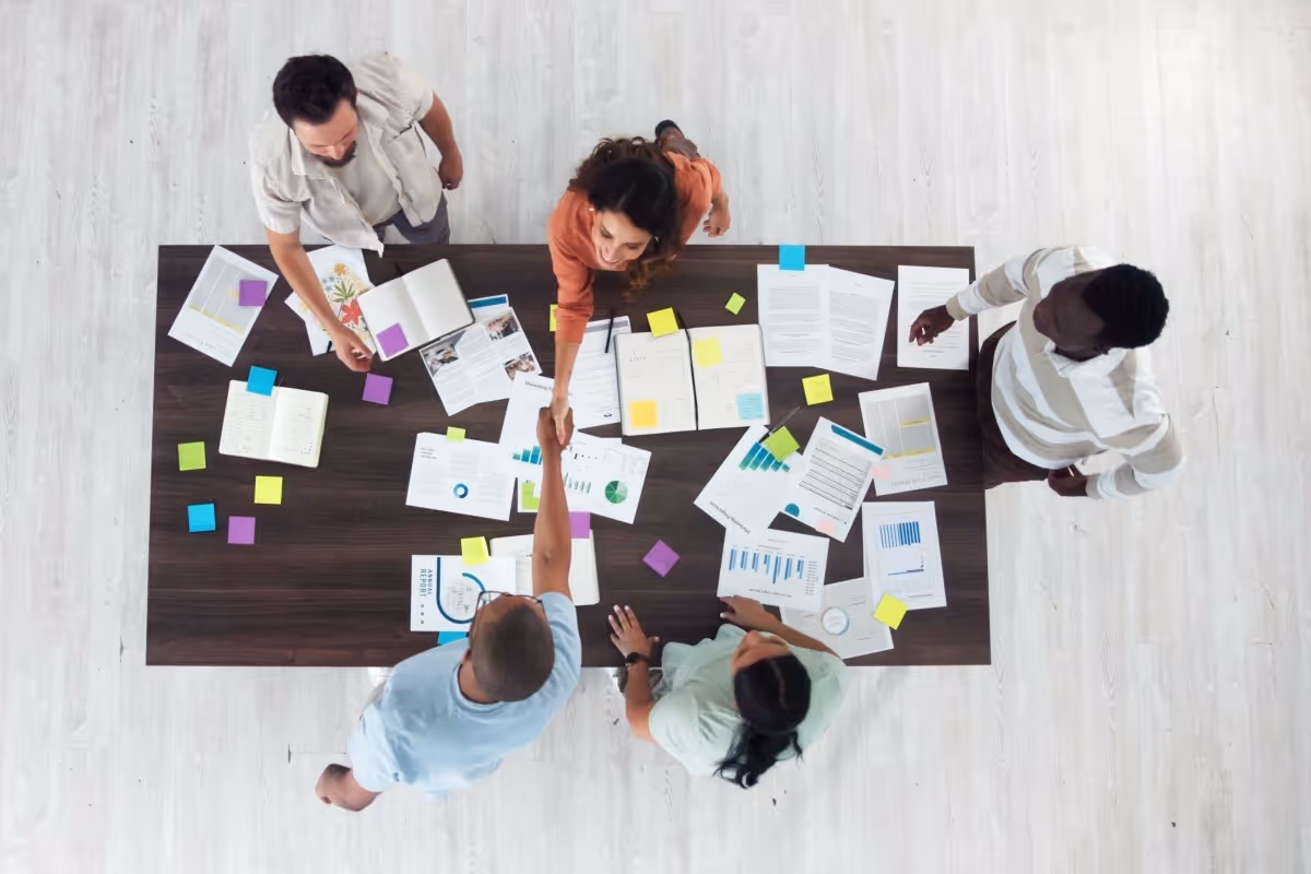 Team members working together with clients