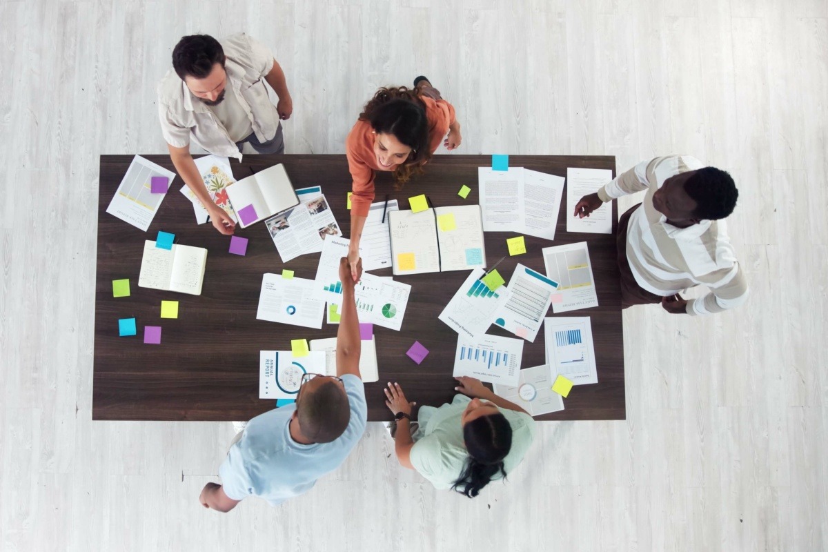 Team members working together with clients