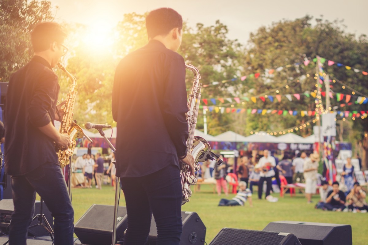 outdoor concert with live musicians playing saxophones