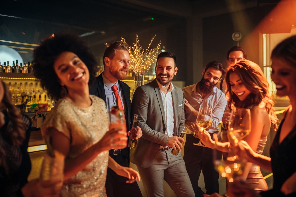 Fun event with a group of people laughing and having drinks
