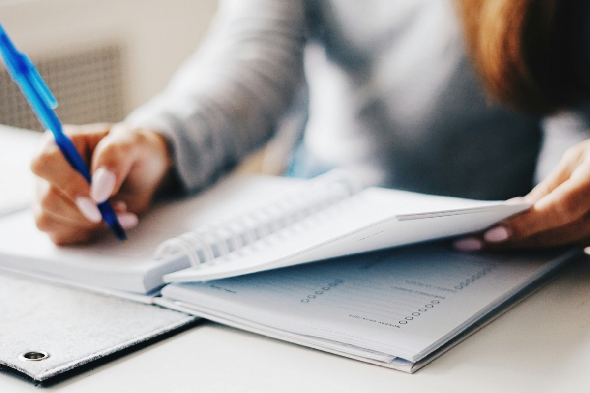 woman making a list of things to check