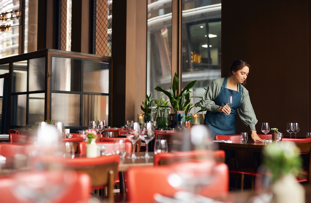 Woman setting tables