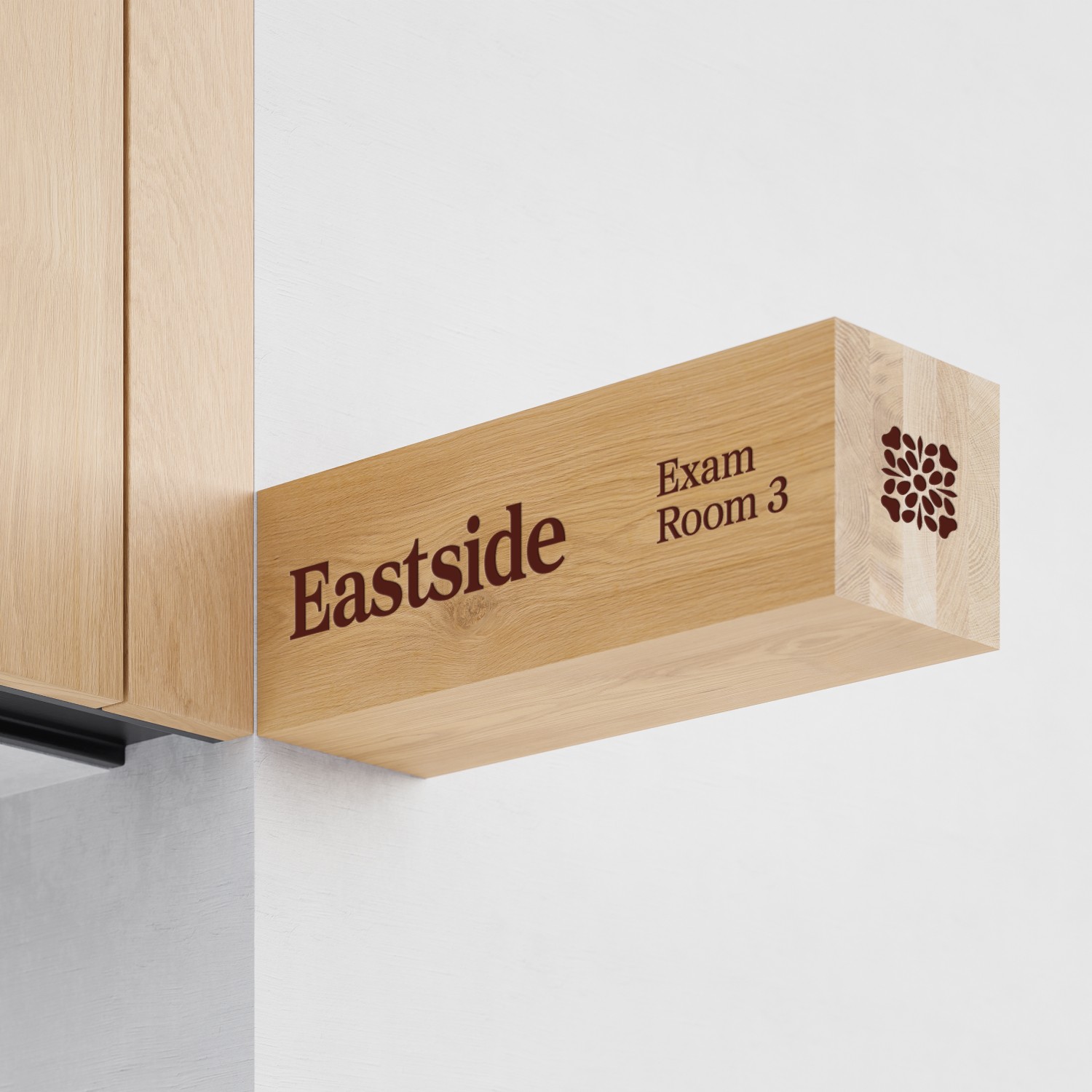Wood interior sign with Eastside Veterinary Service logo