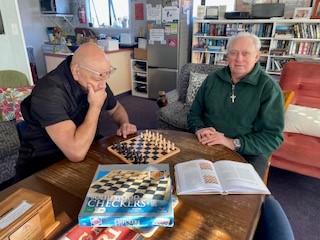 Chris and Mike having a game of chess
