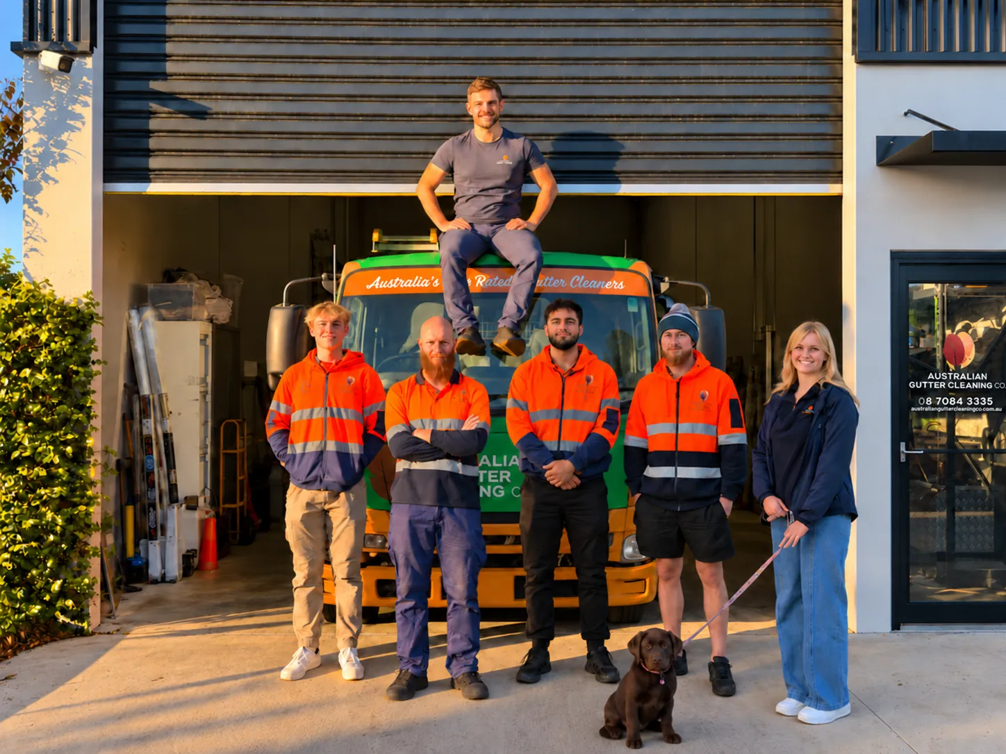 The Australian Gutter Cleaning Co. team with their gutter-cleaning truck in Adelaide.