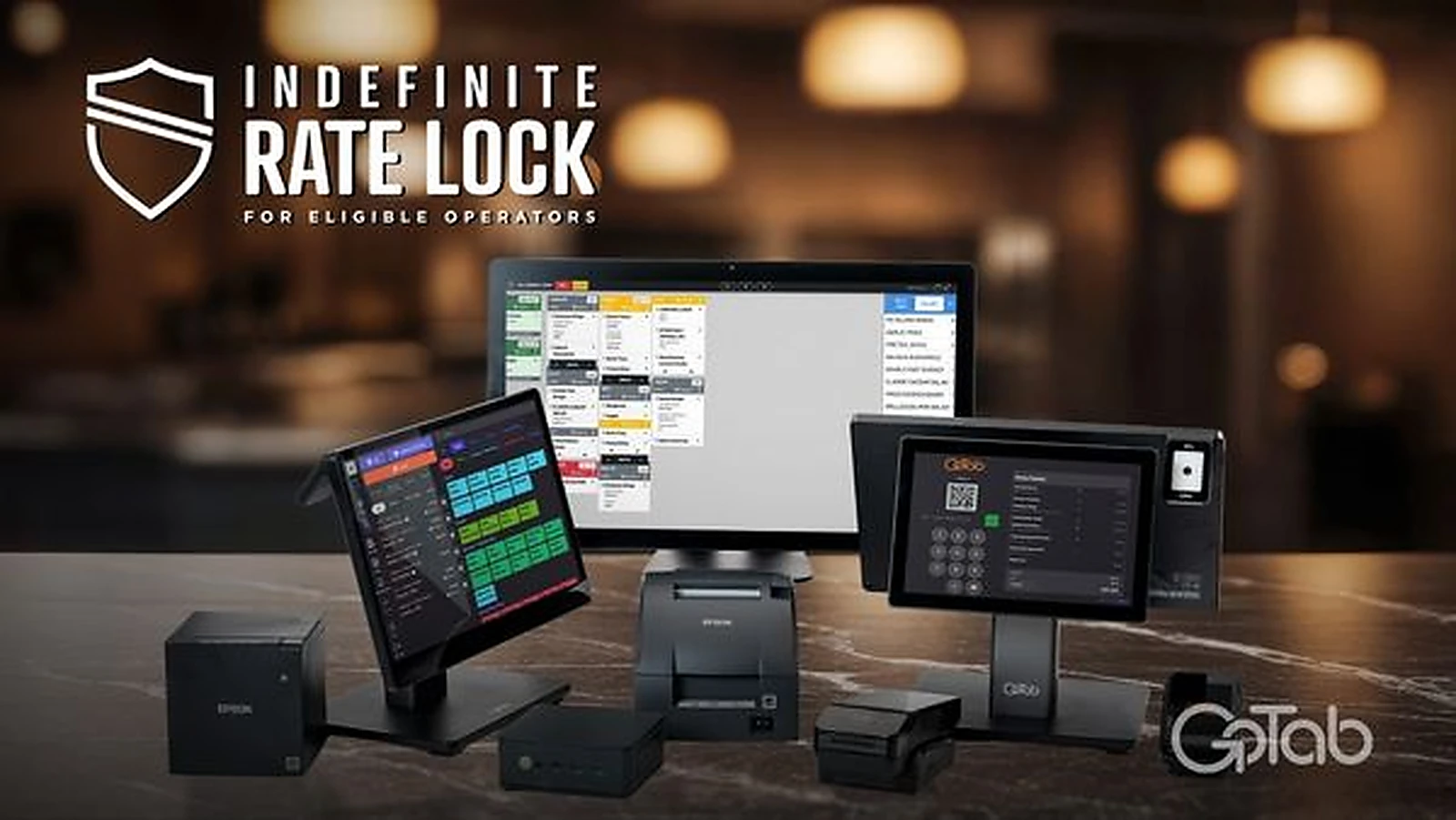 GoTab Indefinite Rate Lock for eligible operators, with GoTab POS terminals, kitchen display screen and payment hardware set up on a bar counter