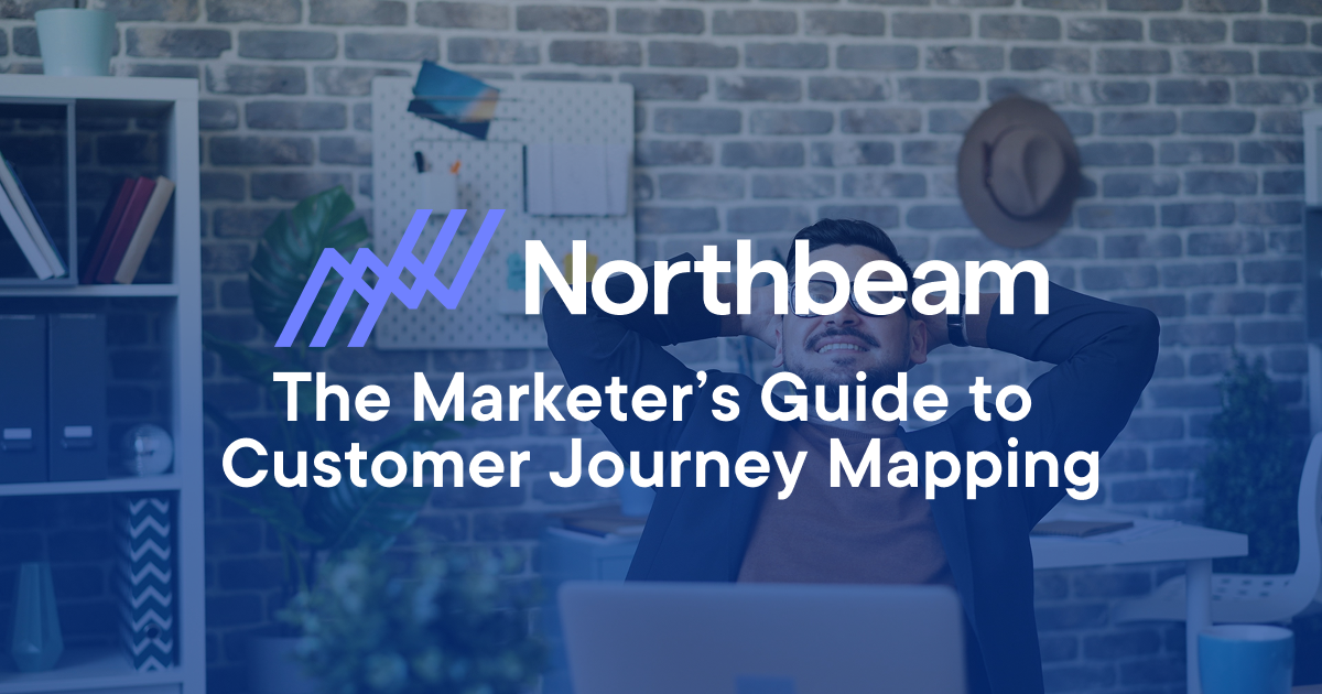 Northbeam presents a marketer’s guide to customer journey mapping, featuring a relaxed professional at a desk, symbolizing strategic planning and marketing success.