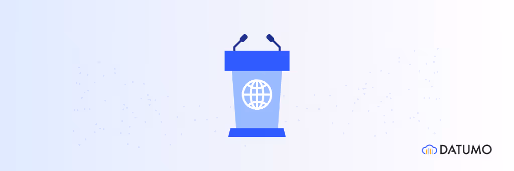  Illustration of a podium with microphones and a globe icon, representing a presentation or public speaking event, with the Datumo logo on the side.