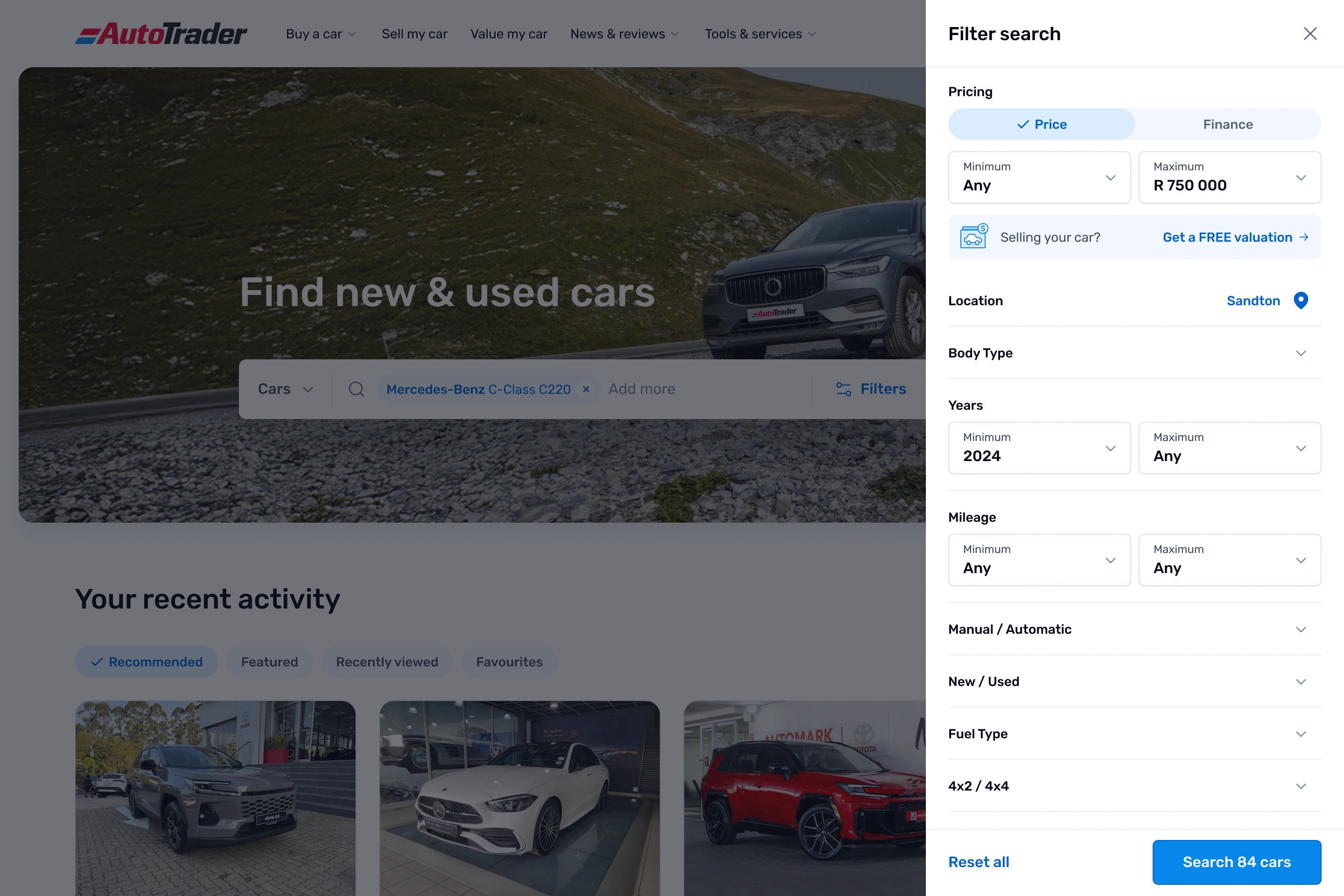 AutoTrader desktop homepage, dimmed, with a "Filter search" panel open on the right. The panel includes a Price and Finance toggle, minimum and maximum price fields set up to R 750 000, location set to Sandton, and collapsible filters for body type, year, mileage, transmission, new or used, fuel type and drive type, with a "Search 84 cars" button.
