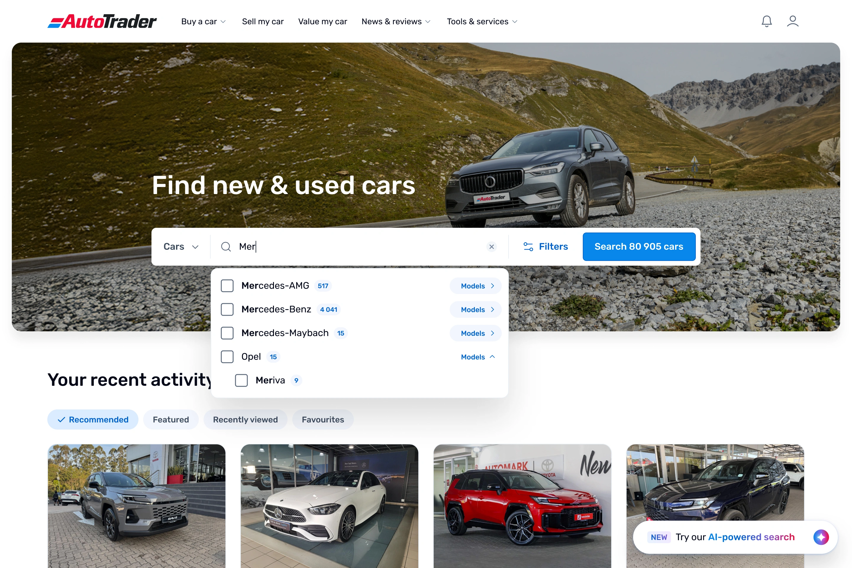 AutoTrader desktop homepage with a user typing "Mer" into the hero search bar. A dropdown suggests Mercedes-AMG, Mercedes-Benz, Mercedes-Maybach and Opel Meriva, each with a listing count and a Models link. A "Try our AI-powered search" prompt sits in the bottom right.