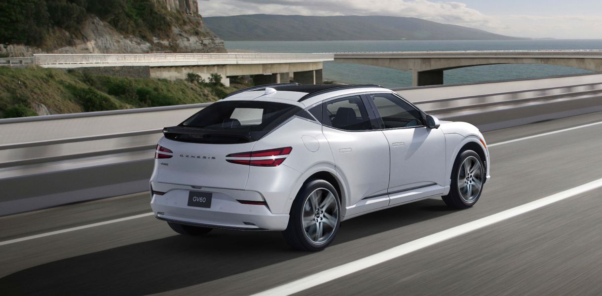 GV60 highway driving assist display with woman driving on highway