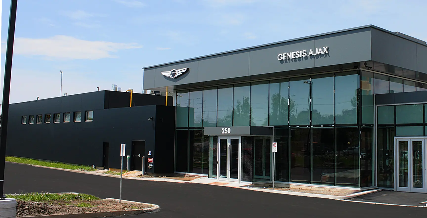 Side view of white Electrified G80 parked