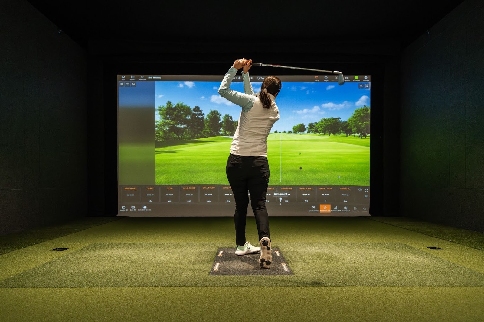 Lisa practices at Total Golf Performance Club