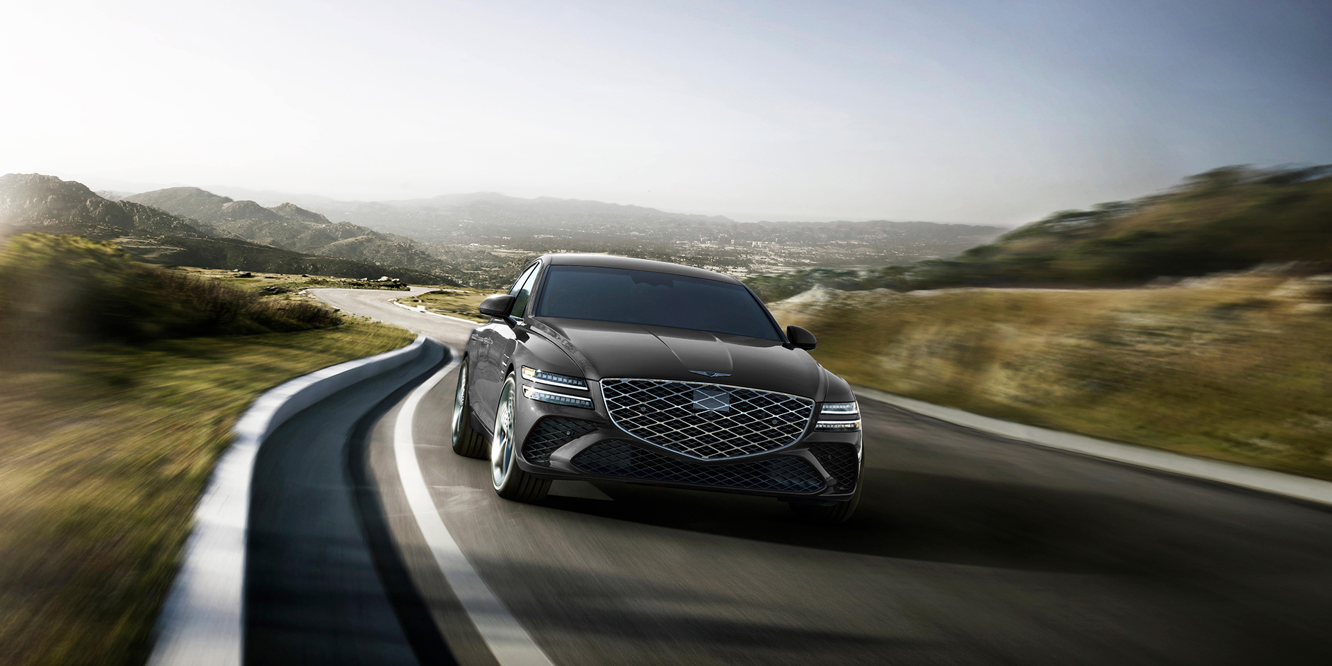 Close up view of G80 front left bumper on road