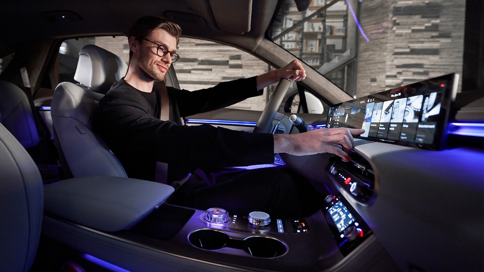 Man reaches for Genesis GV70’s 27" OLED Instrument Cluster and Navigation System