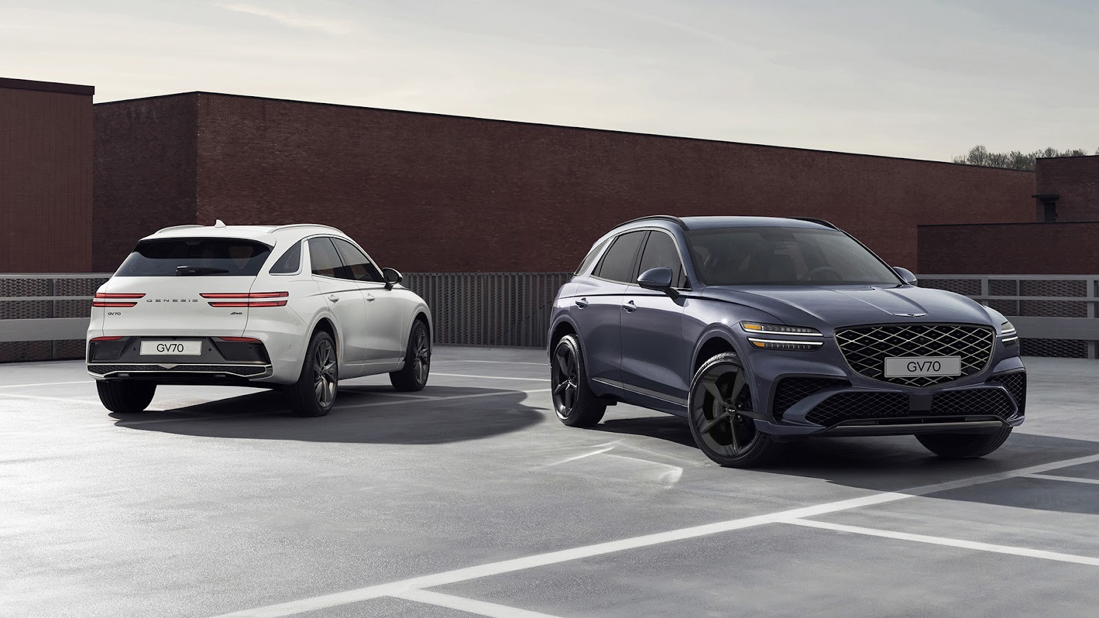 Exterior view of two Genesis GV70 vehicles