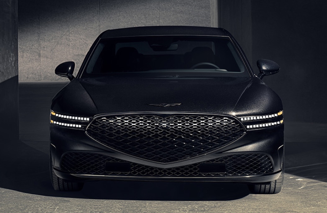 Couple driving Genesis vehicle