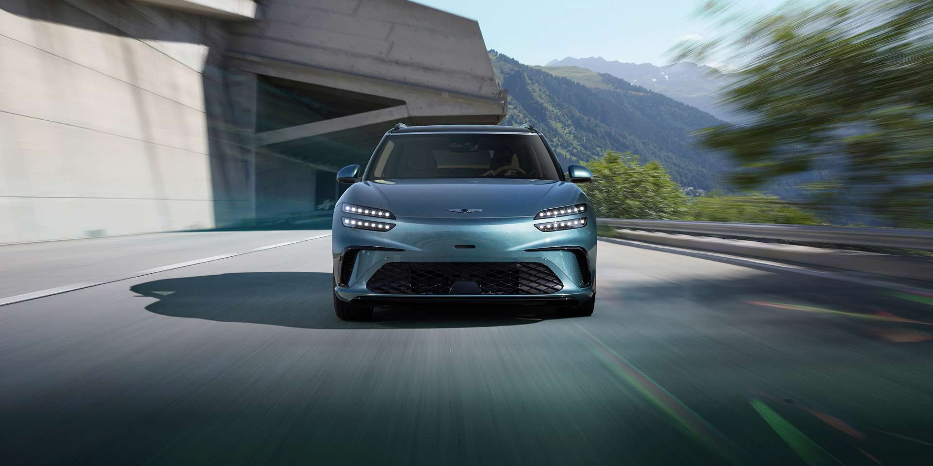 Man standing outside Genesis GV60