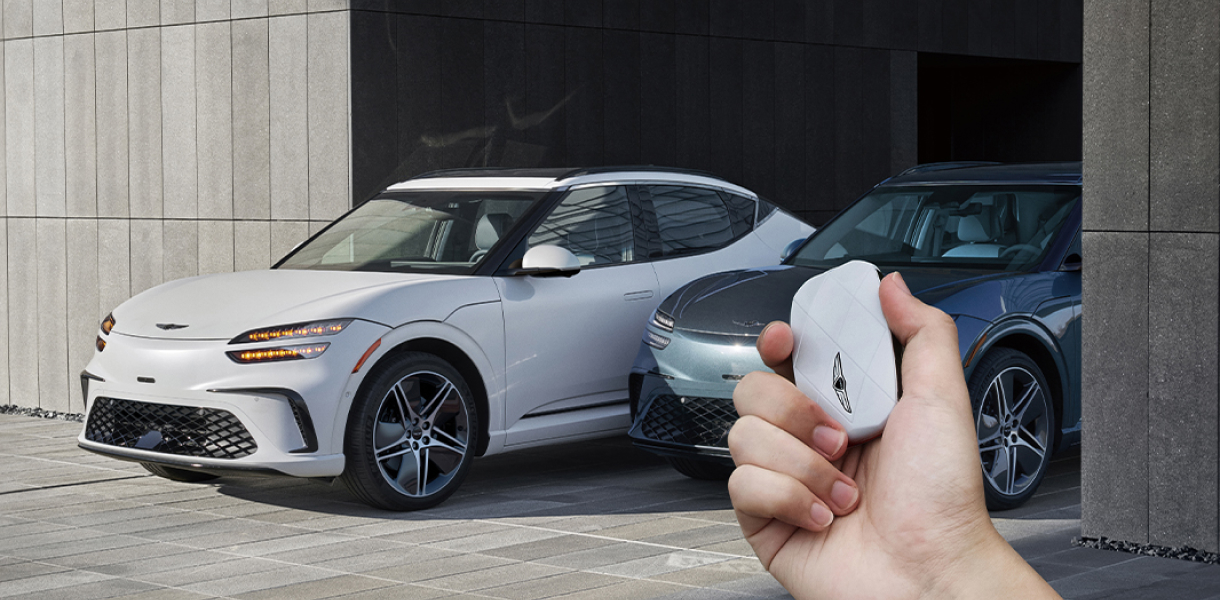 Front 3/4 view of GV60 driving on highway