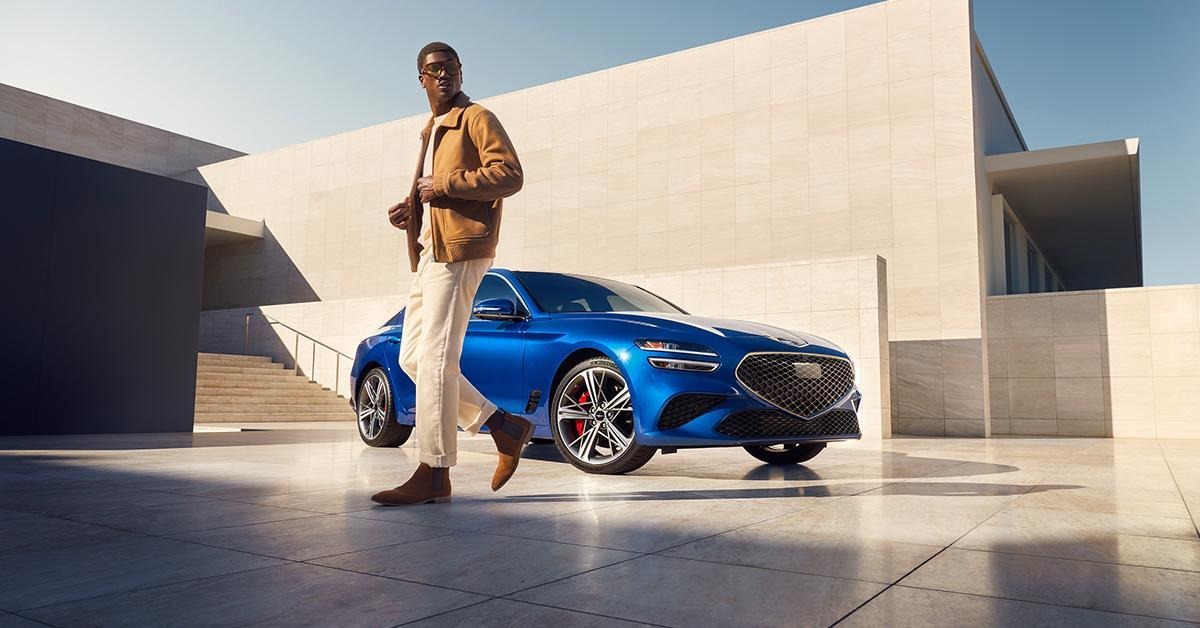Man in front of the Genesis G70