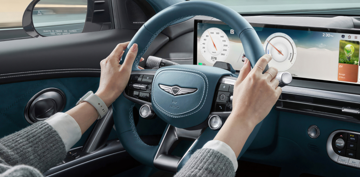 Vehicle passing GV60 parked on roadside