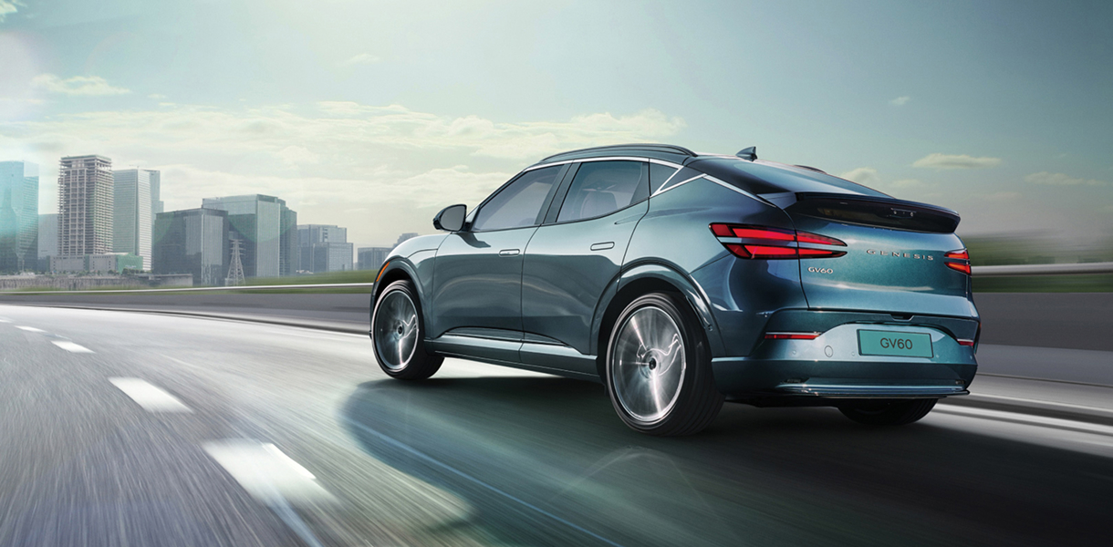 Front 3/4 view of GV60 driving on dirt terrain