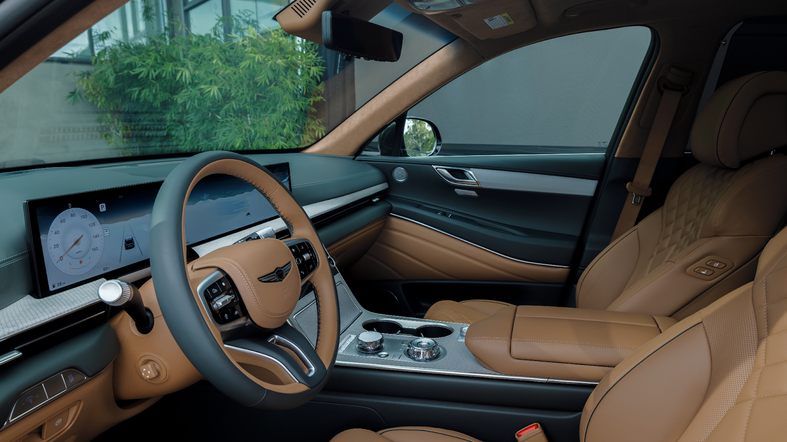 The interior of the GV80, showcasing the available two-tone steering wheel and quilted Nappa leather seats