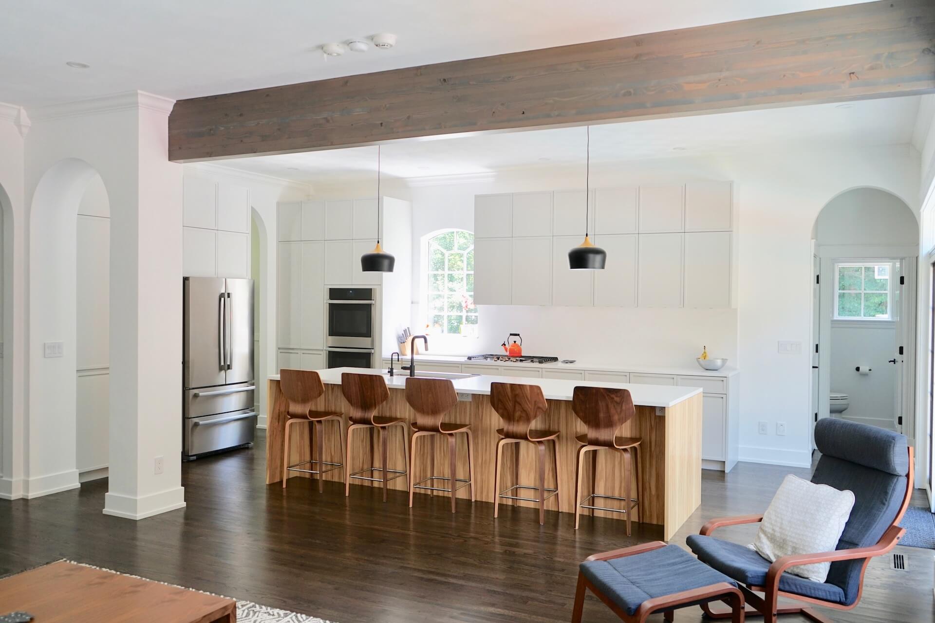 Open kitchen in modern white and wood