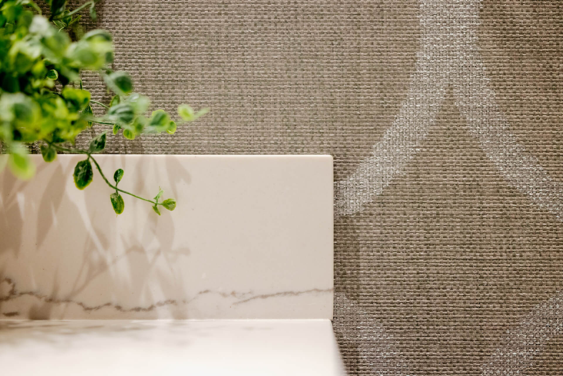 Marble Countertop Against Textured Wallpaper