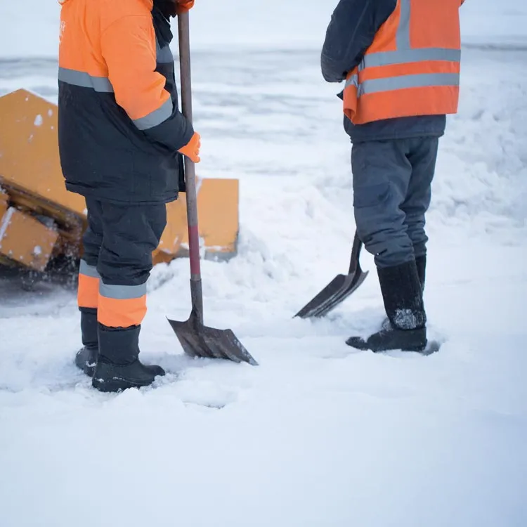 Winter maintenance workers clearing a road from snow 