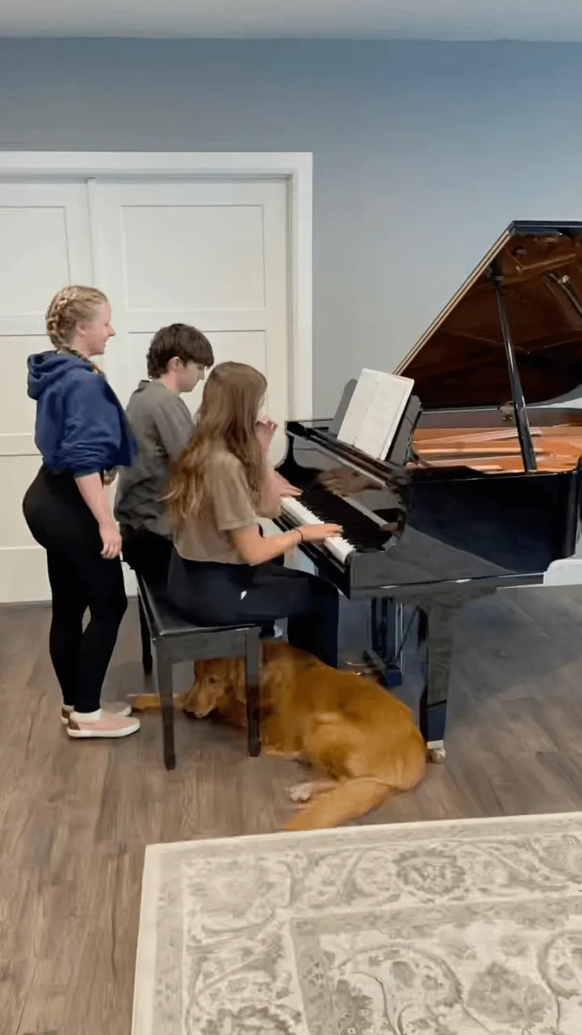 group of kids at piano