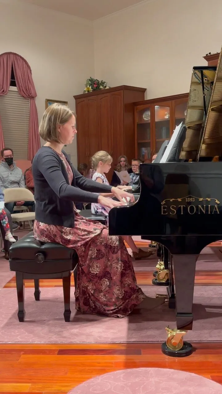girl playing piano