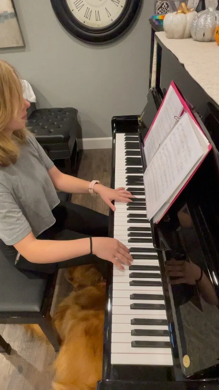 young student playing piano
