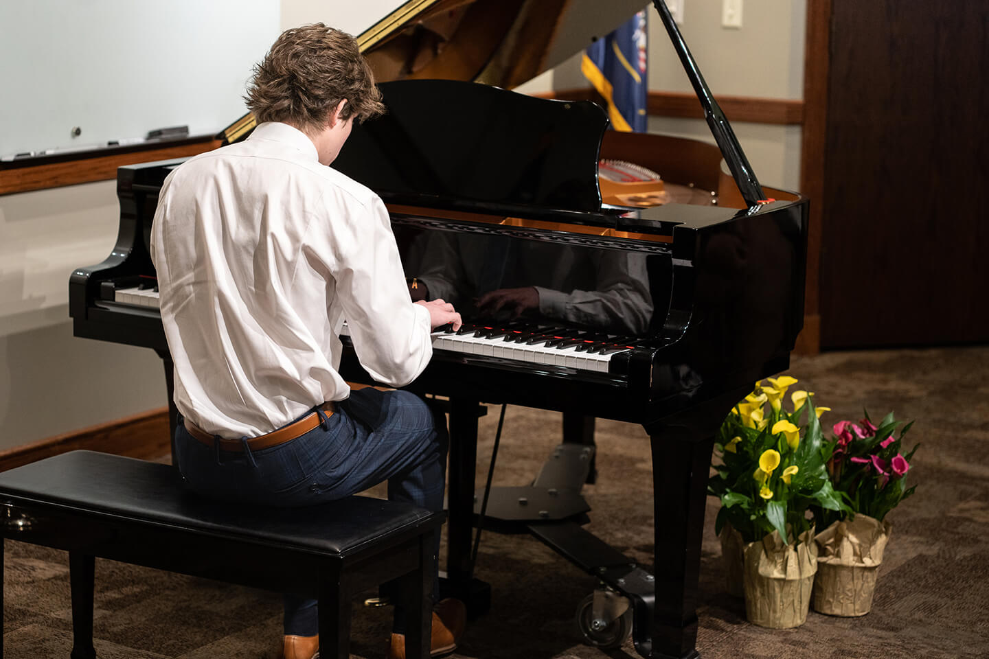 Piano student performing at the Jennifer Jackson Piano Studio ensemble recital