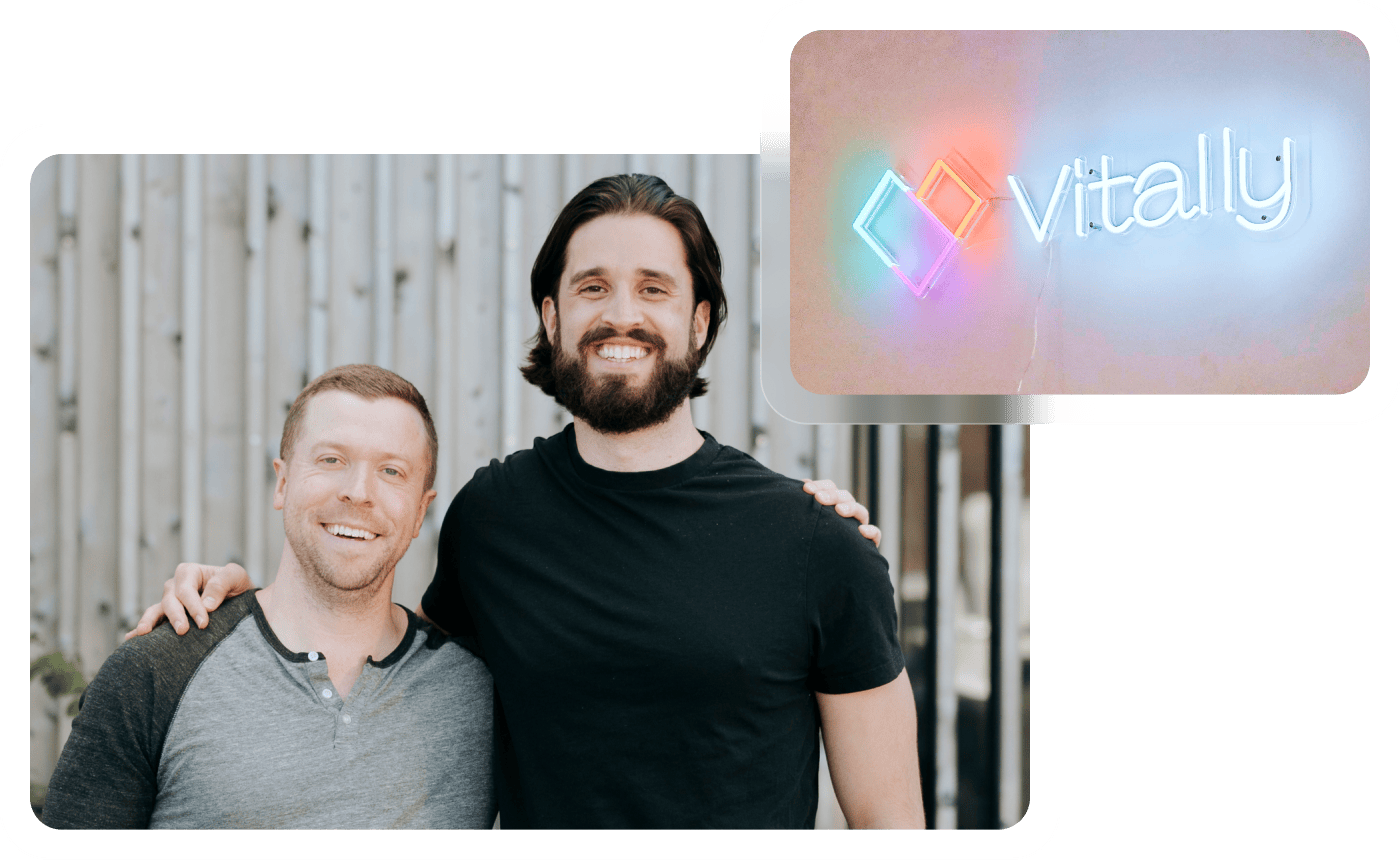 Photo of Vitally founders Jamie Davidson and Patrick Vatterott with a neon version of the Vitally logo