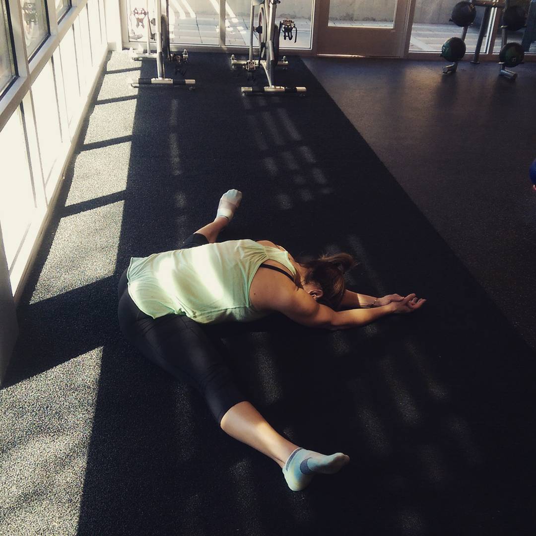 adult woman doing a pancake stretch