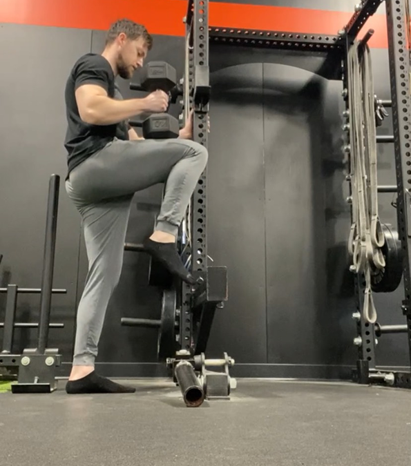 coach jason doing a hip flexor / glute raise