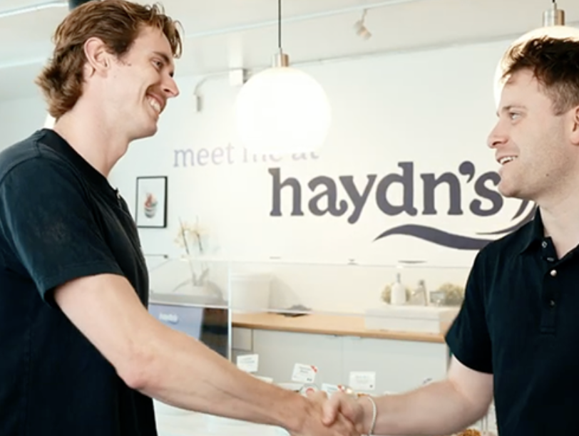 Team facing the camera happily