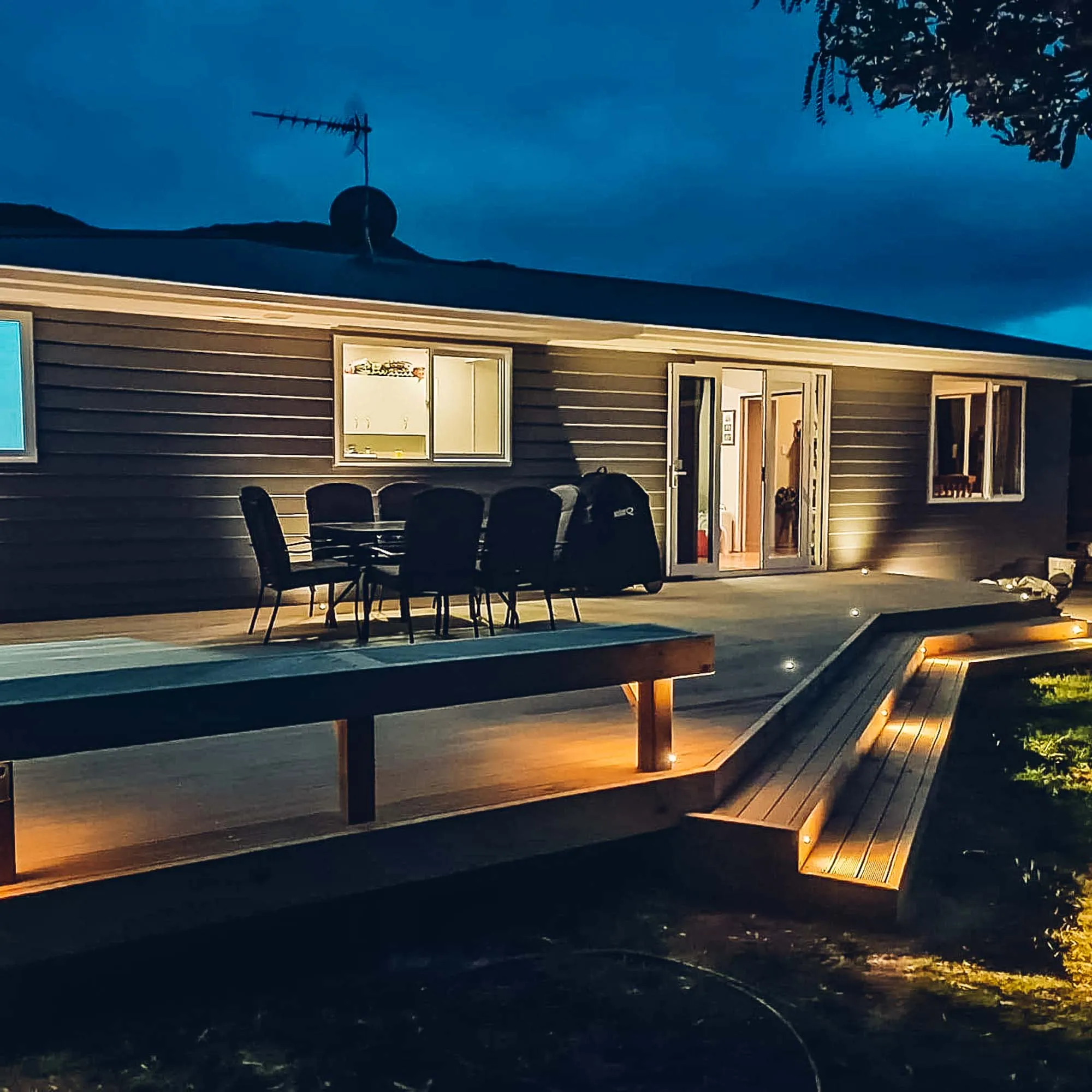 a house with a deck and chairs
