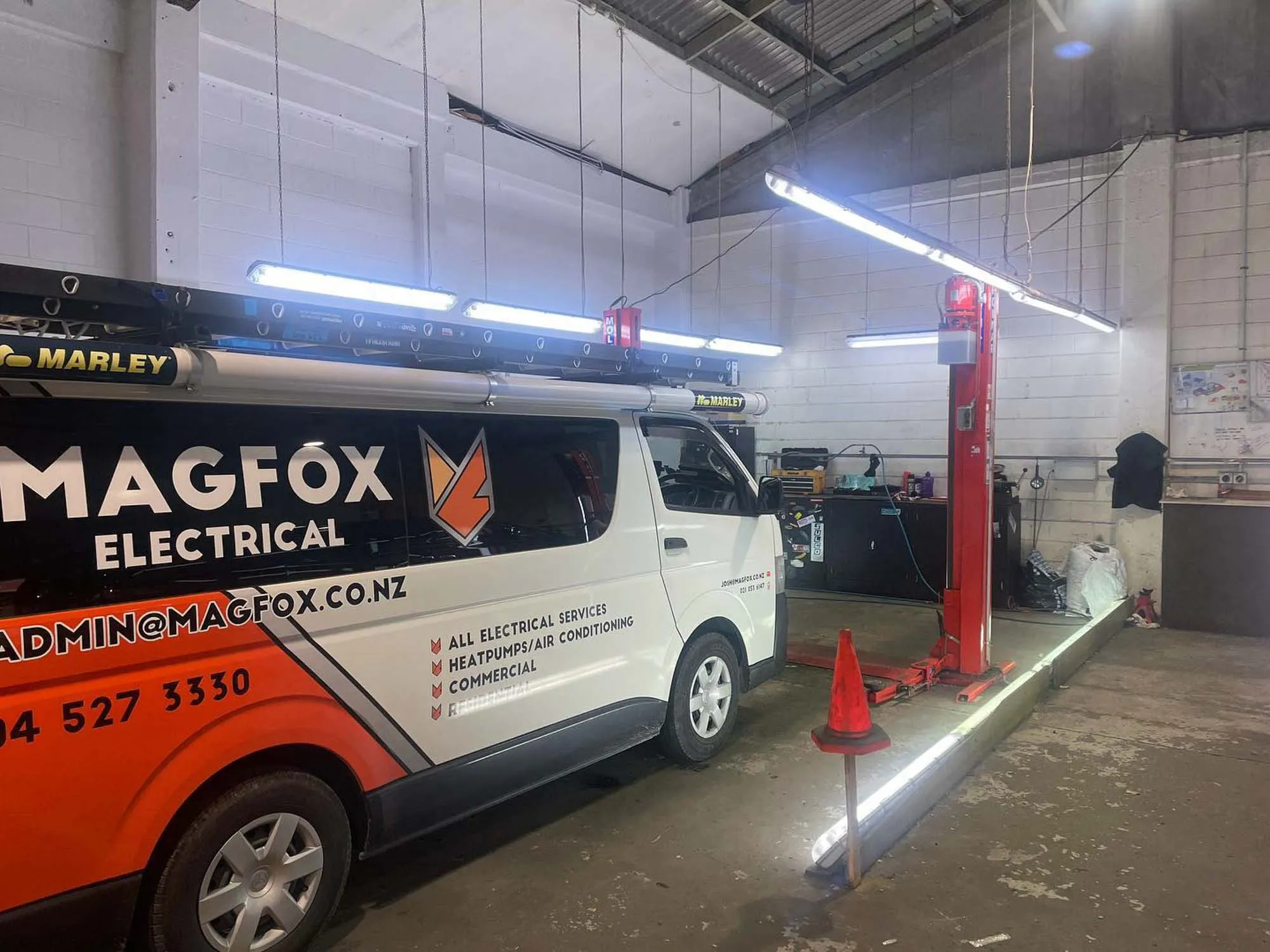 a white van parked in a garage