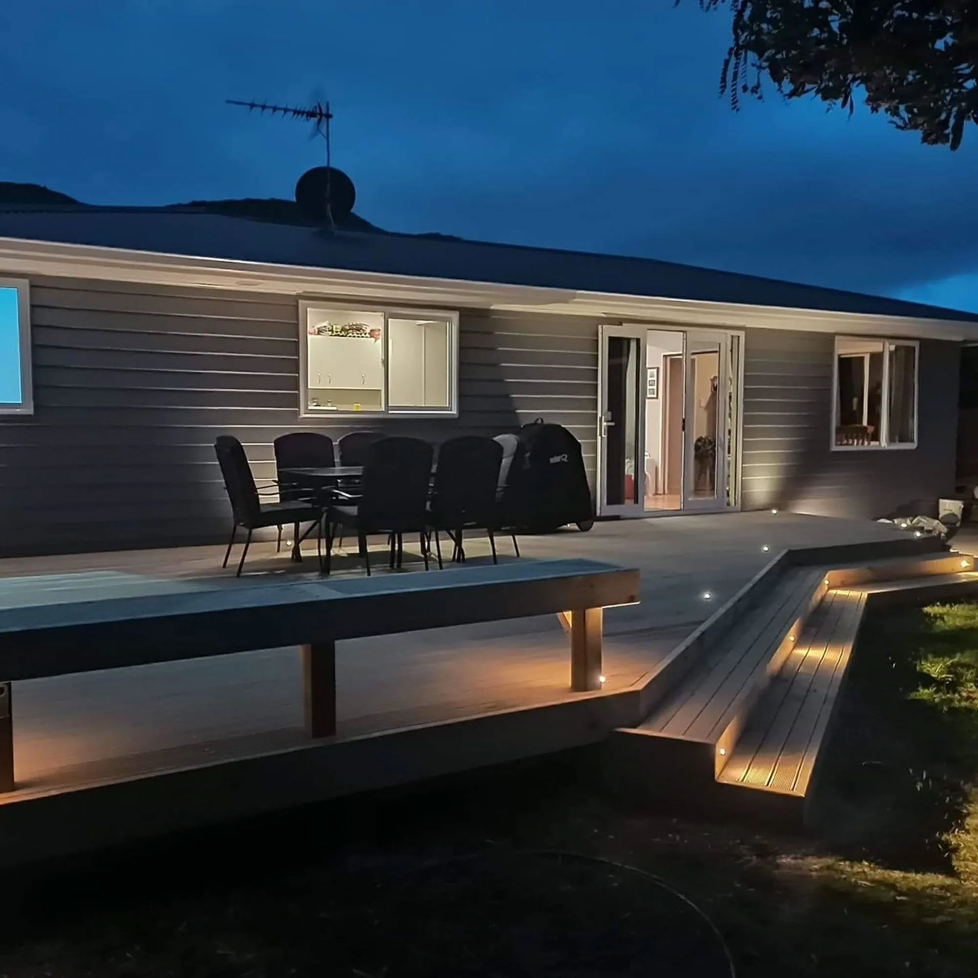 a house with a deck and chairs