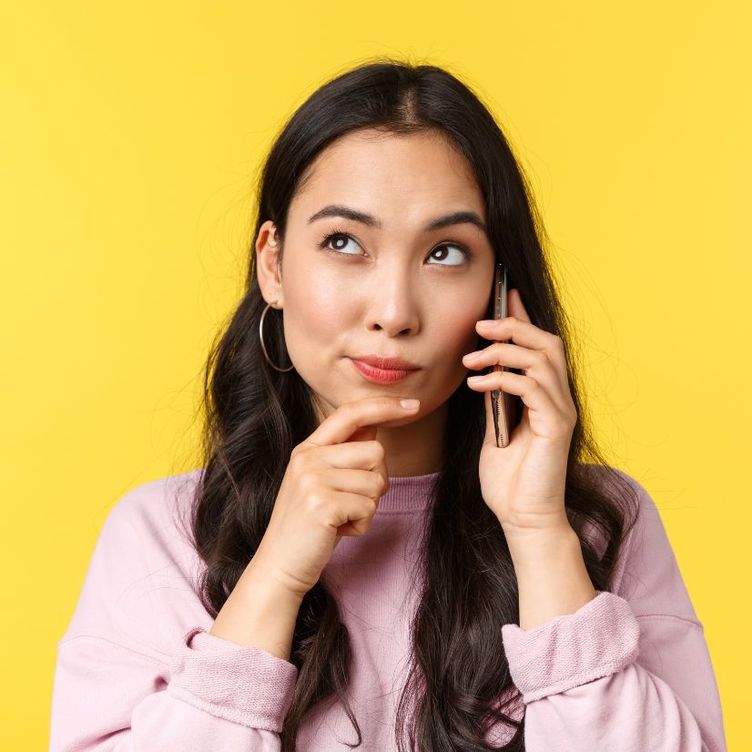 Illustration of a woman considering a question during a phone call.