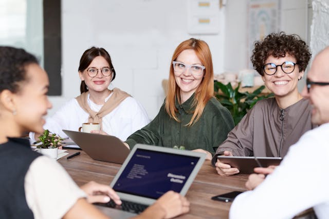 photo of group of people at a table