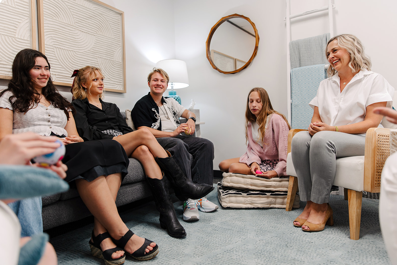 Houston therapy group counseling session with adults seated together, focused on support and connection.