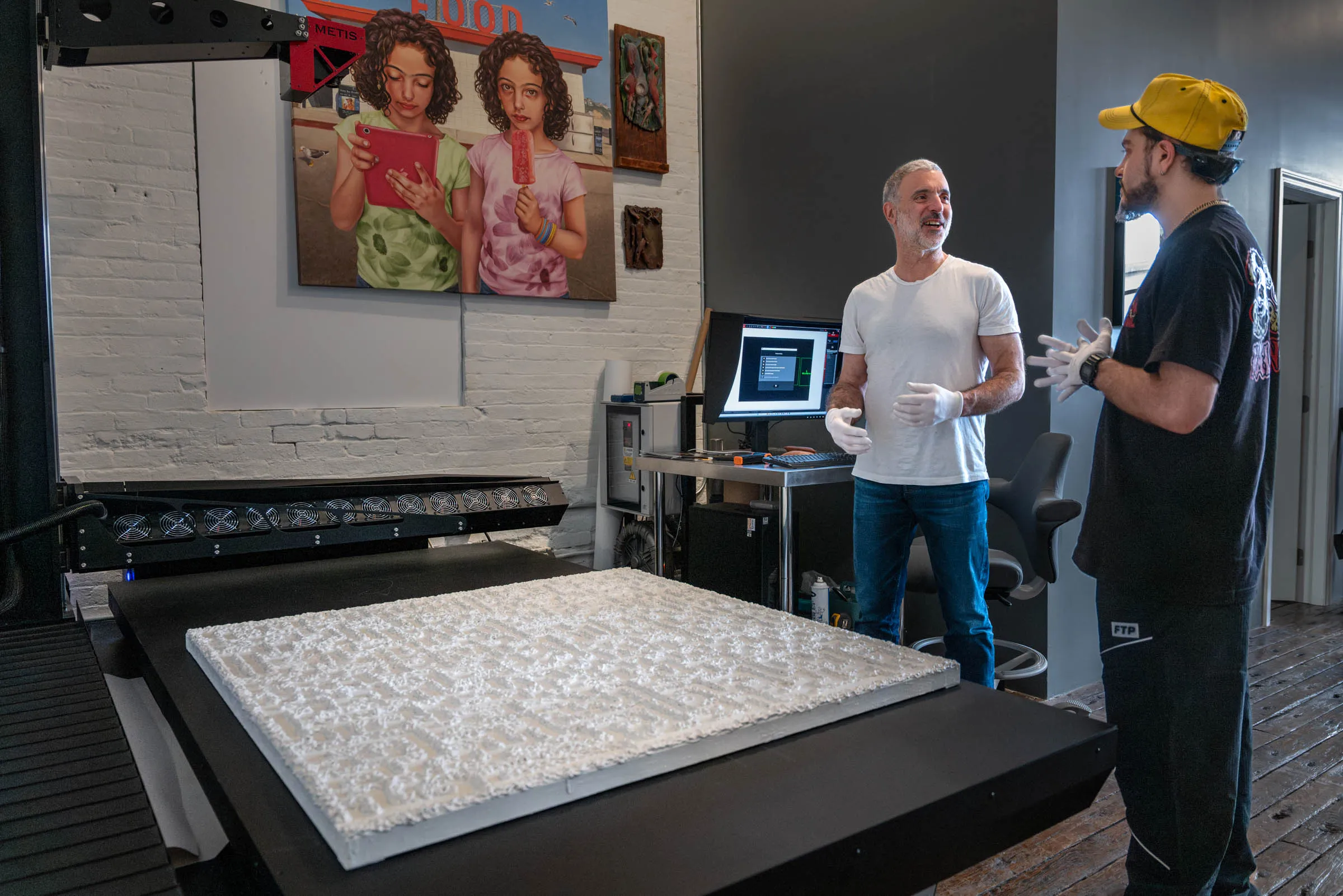 Brooklyn Editions consulting with artist Reno Zaridze on scanning his large textured artwork