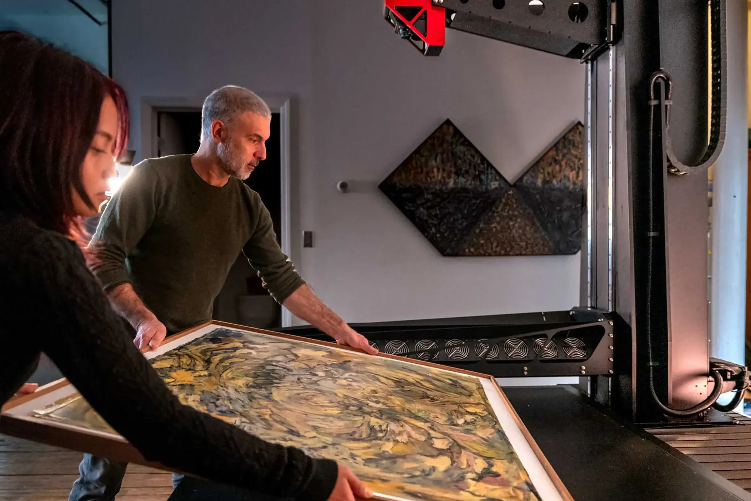 Brooklyn Editions carefully handling artwork to be scanned