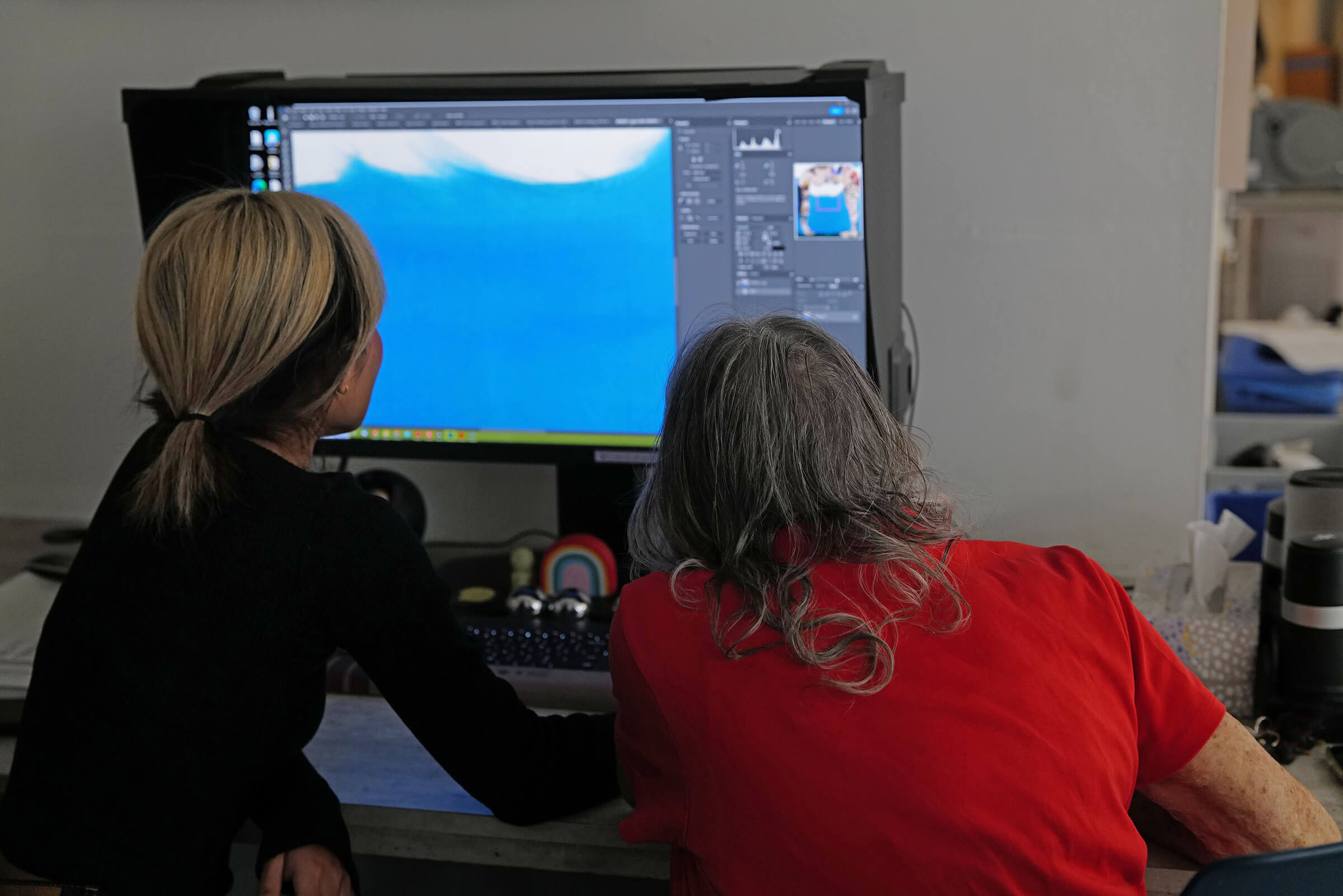 Sitting in front of a computer screen doing Photoshop work and retouching on a print file with Martha Edelheit at the Brooklyn Editions studio