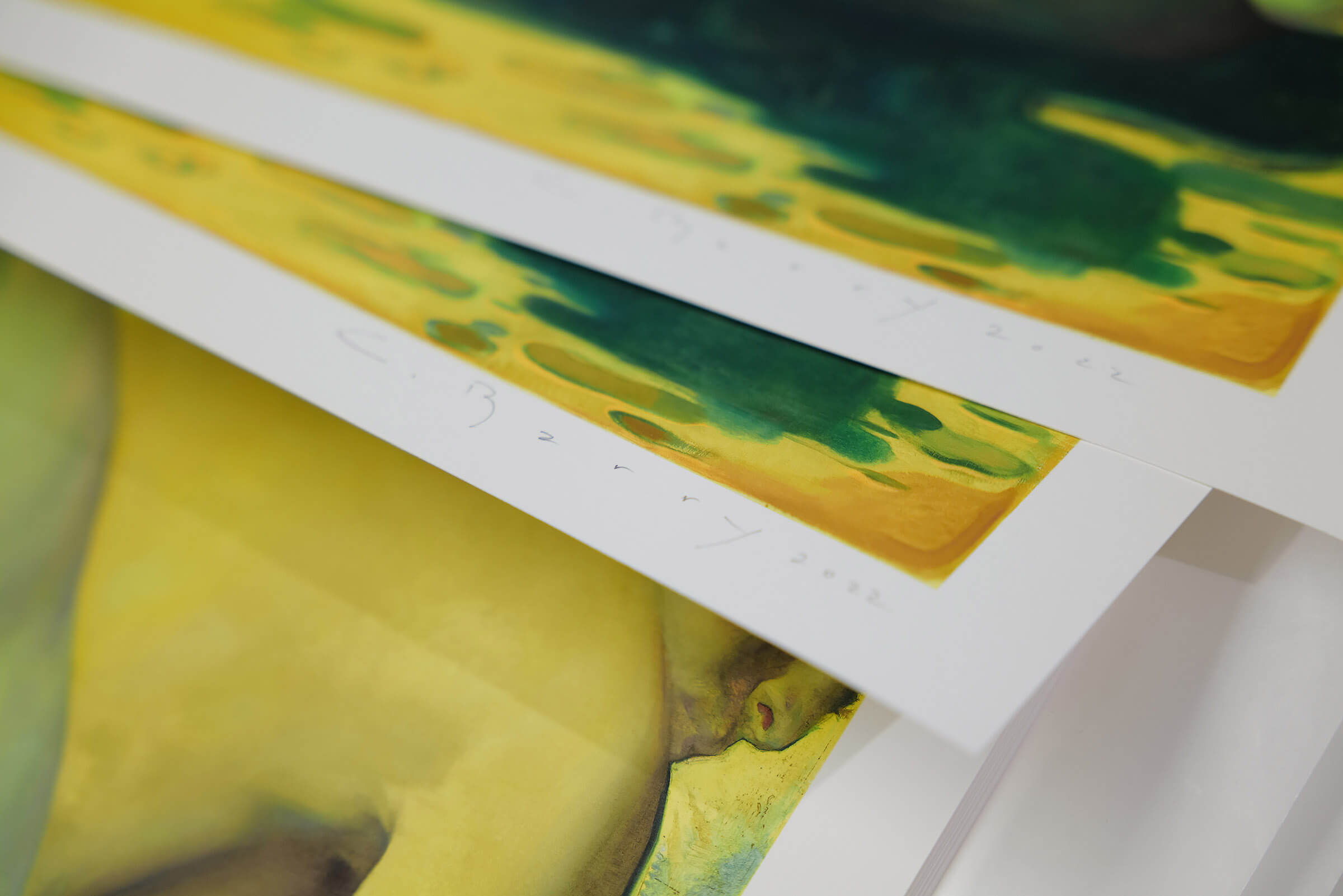 Close-up detail shots of 'The Feet Washers' prints, showcasing Colleen Barry's signature