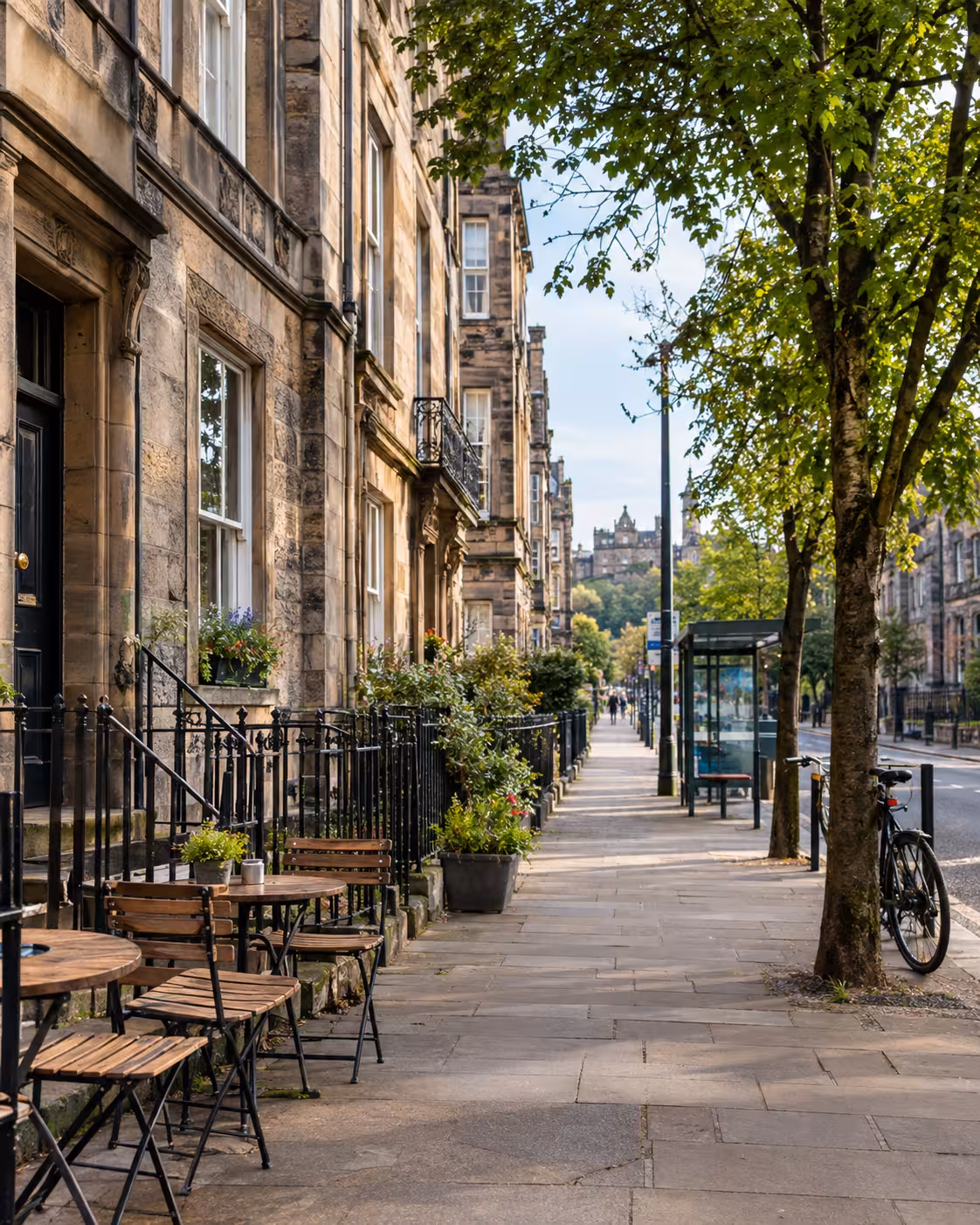 Quiet café-lined street illustrating daily life for employees relocating to Edinburgh